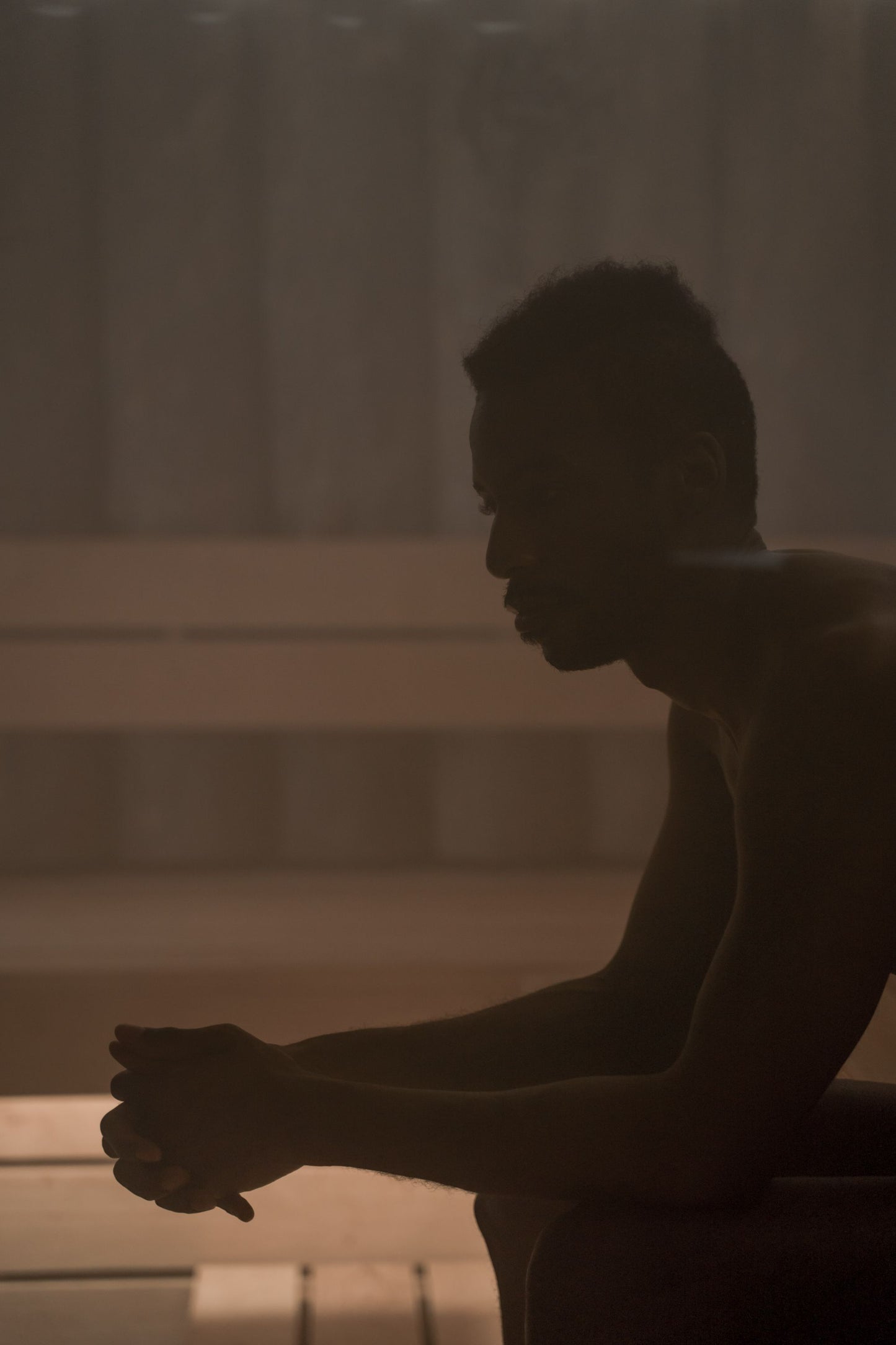 A figure sitting still in the heat of a steam filled sauna, Guerlain Spa at Raffles London, The OWO