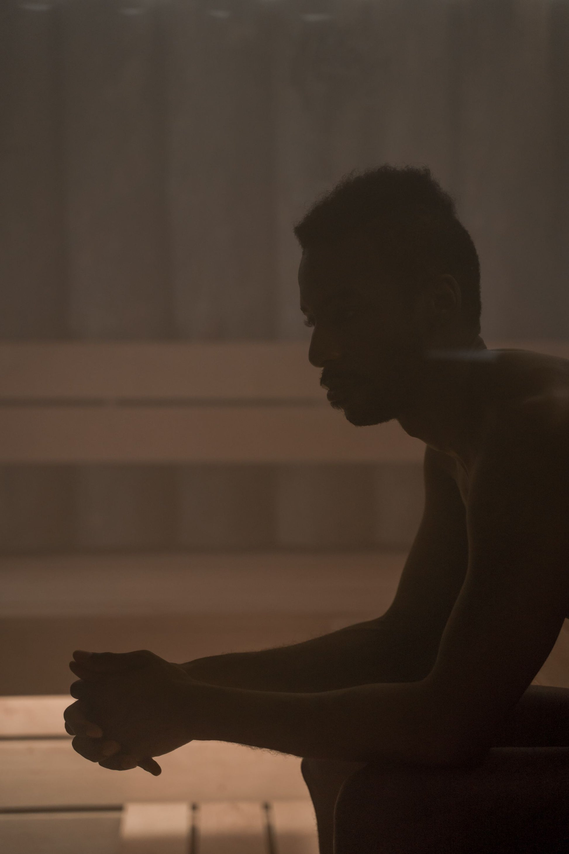 A figure sitting still in the heat of a steam filled sauna, Guerlain Spa at Raffles London, The OWO