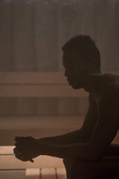 A figure sitting still in the heat of a steam filled sauna, Guerlain Spa at Raffles London, The OWO