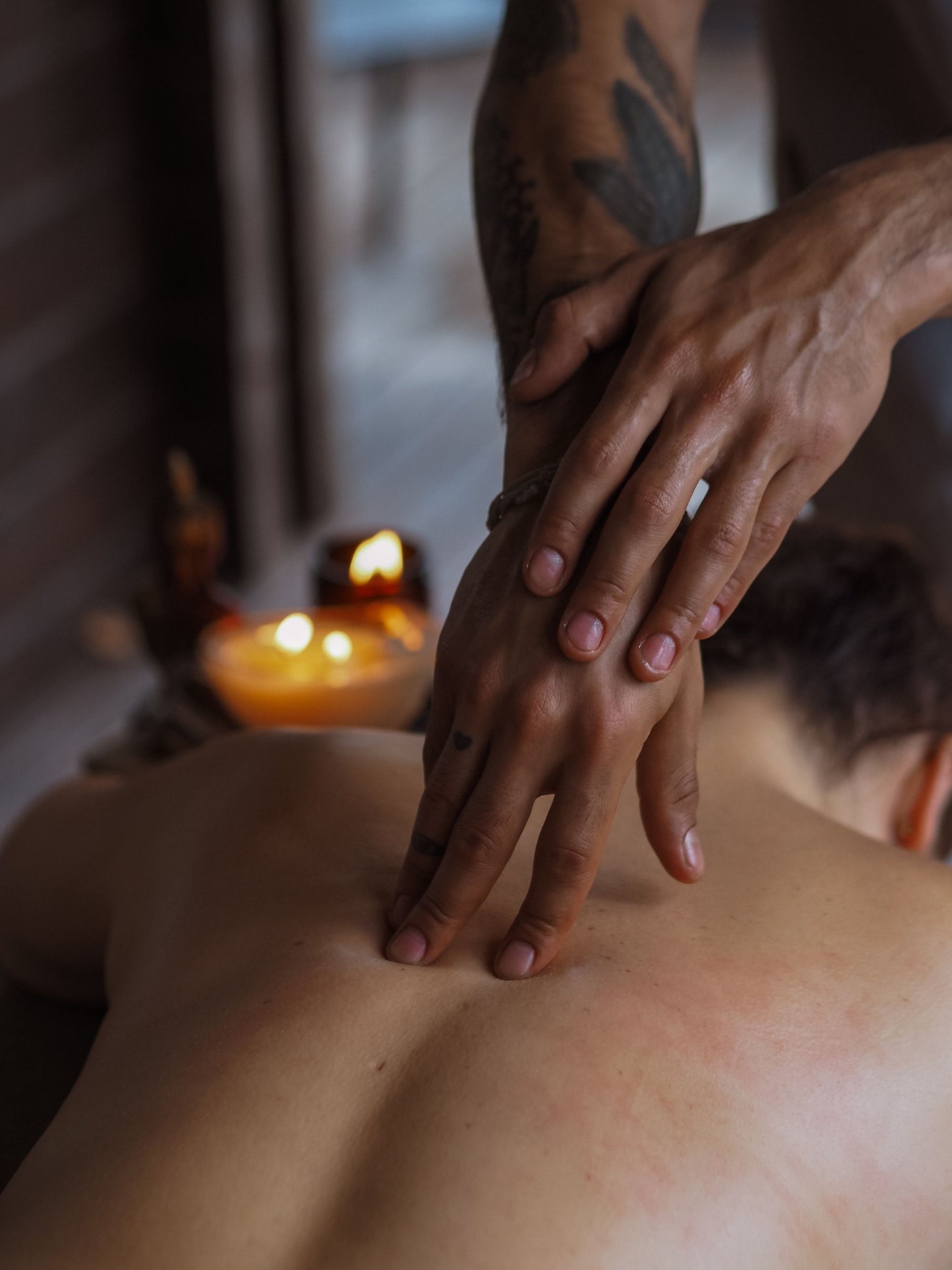 A back massage worked slowly by candlelight in a warm, low lit room, Guerlain Spa at Raffles London, The OWO