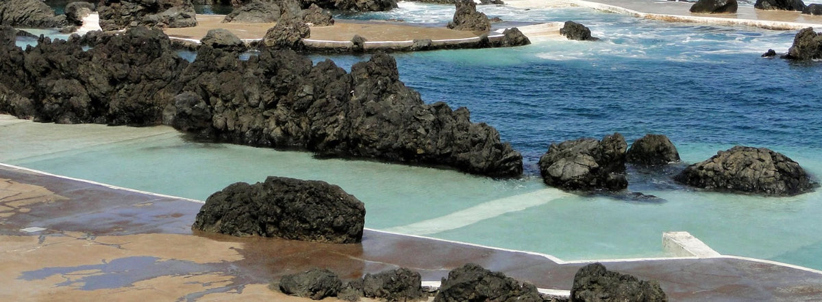 Turquoise natural pool meeting the deep blue Atlantic near The Scarlet Spa, Mawgan Porth