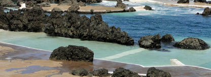 Turquoise natural pool meeting the deep blue Atlantic near The Scarlet Spa, Mawgan Porth